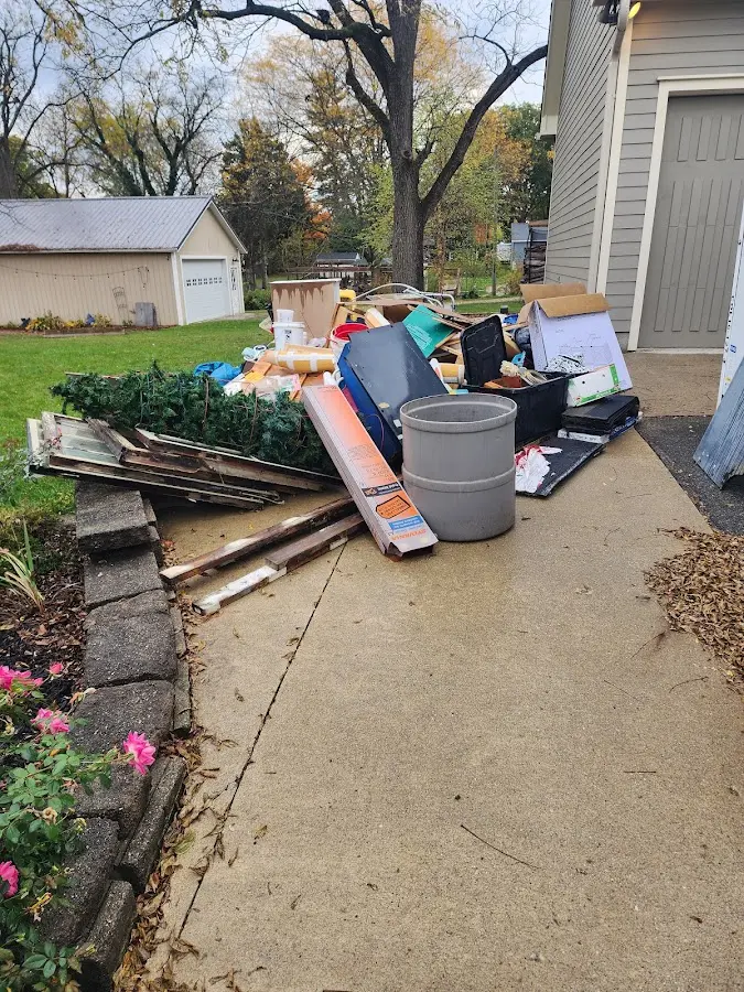 Dumpster being loaded with debris for 3 Yard Dumpster Rental in West Dundee